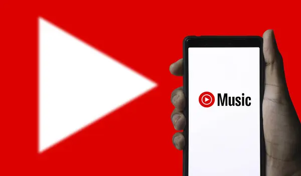 stock image Dhaka,Bangladesh 27 July 2024: In this photo illustration,the logo of YouTube Music,is displayed on a smartphone screen.