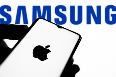 Dhaka,Bangladesh 15 September 2024:Apple vs Samsung logo on smartphone. clipart