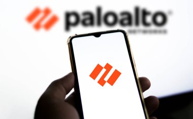 In this photo illustration Palo Alto Networks logo of an American cybersecurity company is seen on a mobile phone and a computer screen-Dhaka,Bangladesh 23 Sep 2024. clipart