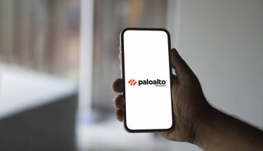 In this photo illustration Palo Alto Networks logo of an American cybersecurity company is seen on a mobile phone and a computer screen-Dhaka,Bangladesh 23 Sep 2024. clipart