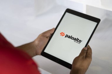 In this photo illustration Palo Alto Networks logo of an American cybersecurity company is seen on a mobile phone and a computer screen-Dhaka,Bangladesh 23 Sep 2024. clipart