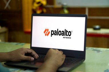 In this photo illustration Palo Alto Networks logo of an American cybersecurity company is seen on a mobile phone and a computer screen-Dhaka,Bangladesh 23 Sep 2024. clipart