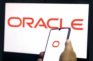 ORACLE logo displayed on smartphone screen. ORACLE is a multinational computer technology corporation-Dhaka,Bangladesh 23 Sep 2024. clipart