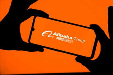 Dhaka,Bangladesh 11 Oct 2024:Alibaba group  logo displayed on a smartphone. clipart