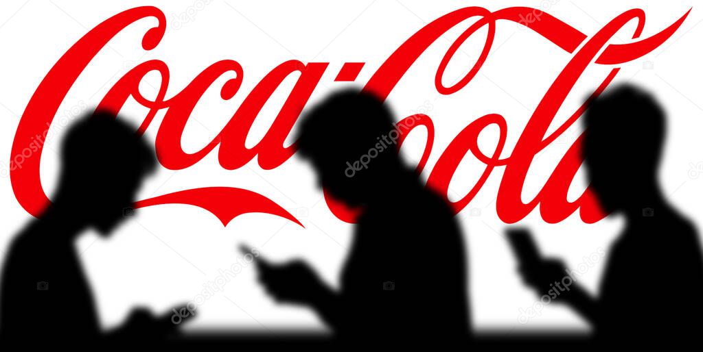 Coca-Cola logo is seen on a mobile phone and a computer screen-Dhaka,Bangladesh 11 Oct 2024.