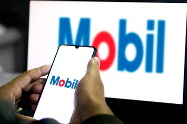 Dhaka,Bangladesh 10 Oct 2024:Mobil logo on smartphone. clipart