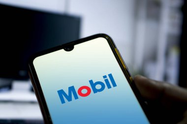 Dhaka,Bangladesh 10 Oct 2024:Mobil logo on smartphone. clipart