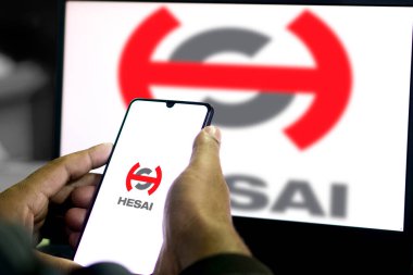 Hesai logo on smartphone, Dhaka, Bangladesh 29 Nov 2024. clipart