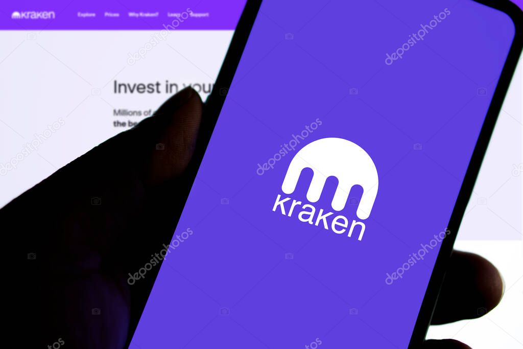 Dhaka, Bangladesh 13 Dec 2024:Kraken is cryptocurrency exchange. A smartphone with the Kraken logo on the background of the live trading webpage.