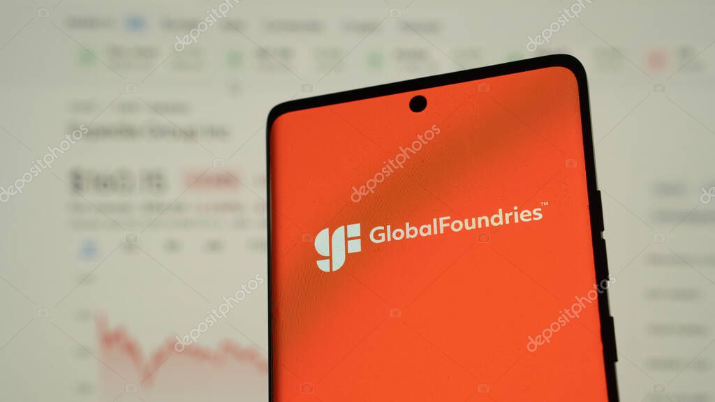 Dhaka, Bangladesh 04 May 2025: GlobalFoundries Inc. logo is seen on a mobile phone and a computer screen.