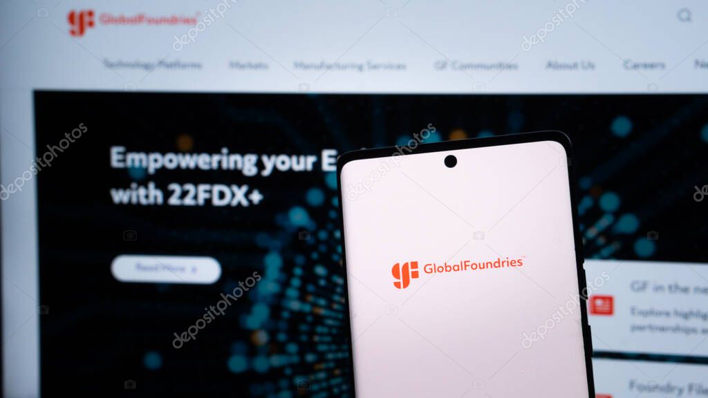 Dhaka, Bangladesh 04 May 2025: GlobalFoundries Inc. logo is seen on a mobile phone and a computer screen.