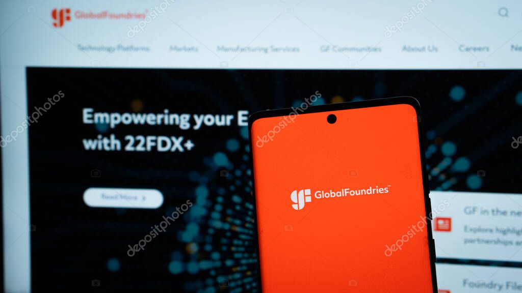 Dhaka, Bangladesh 04 May 2025: GlobalFoundries Inc. logo is seen on a mobile phone and a computer screen.