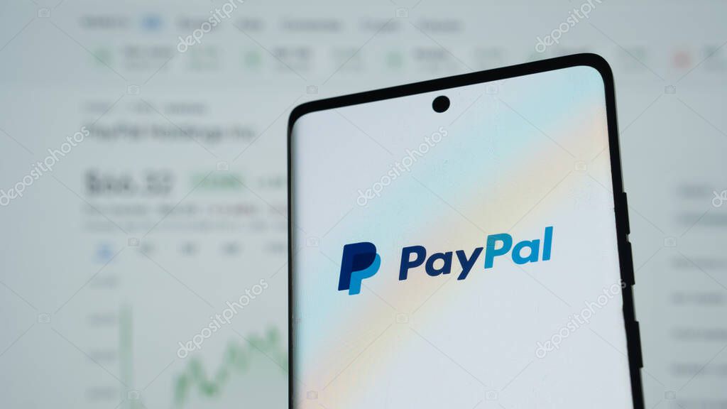 Dhaka, Bangladesh 04 May 2025: Smartphone on surface showing PayPal logo.