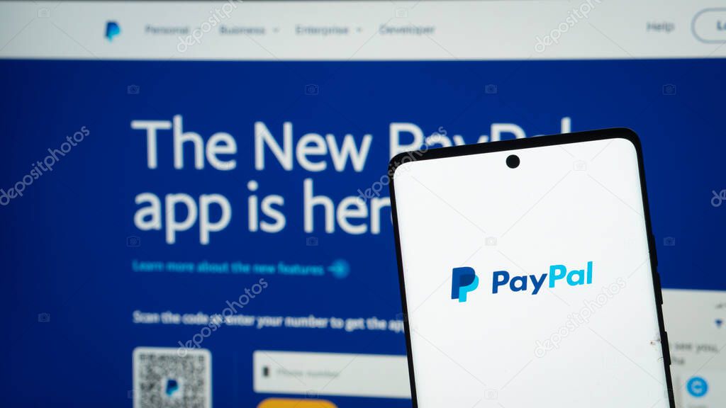 Dhaka, Bangladesh 04 May 2025: Smartphone on surface showing PayPal logo.