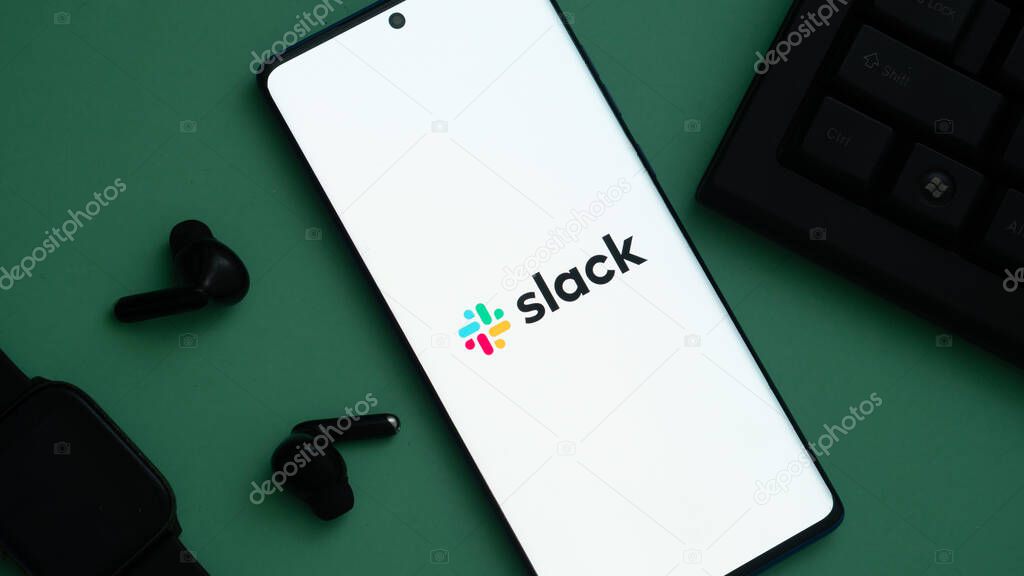 Dhaka, Bangladesh 03 May 2025: Mobile phone with logo of American software company Slack Technologies LLC on screen in front of website.