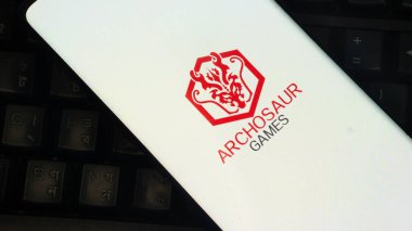 Dhaka, Bangladesh 01 June 2025:White book cover featuring Archosaur Games logo, close-up view.