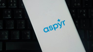 Dhaka, Bangladesh 01 June 2025:Aspyr logo on a white surface against a background of a keyboard.