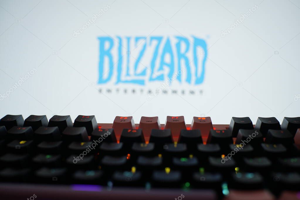 Dhaka, Bangladesh 02 June 2025:Blizzard Entertainment logo above a backlit keyboard in a dark, contrasting environment.