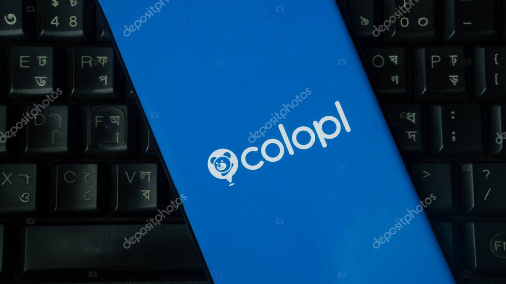 Dhaka, Bangladesh 02 June 2025:Blue device displaying colopl logo on a background of keyboard keys.