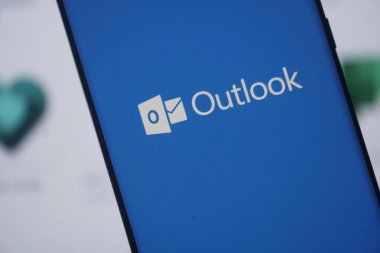 Dhaka, Bangladesh 23 August 2025:Outlook app logo shown on a smartphone screen in blue