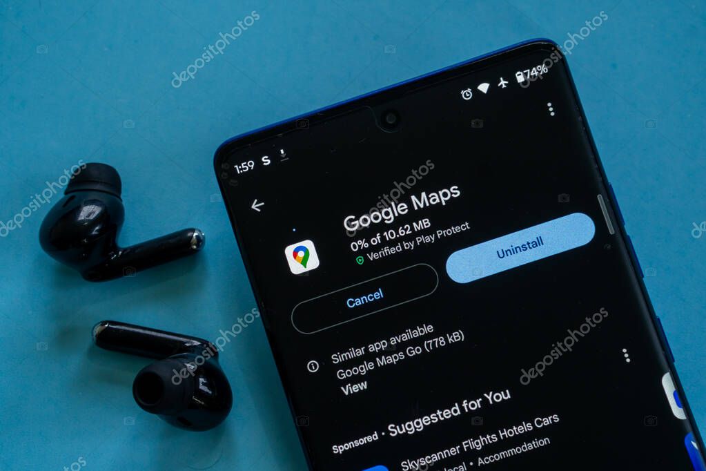Dhaka, Bangladesh 23 August 2025:Smartphone displaying Google Maps uninstall option next to earbuds