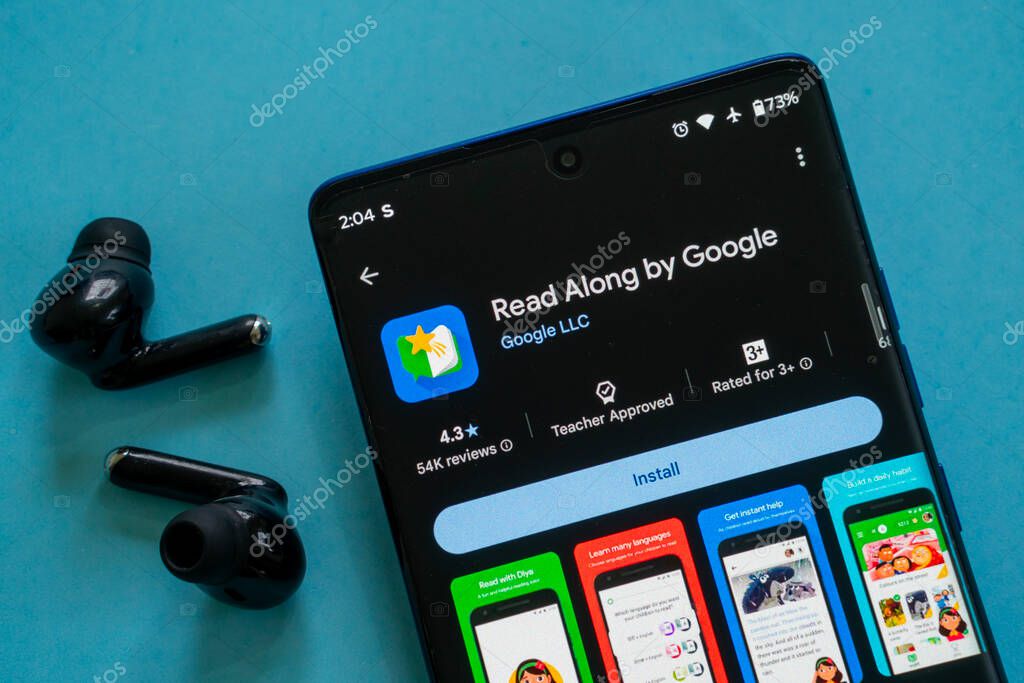 Dhaka, Bangladesh 23 August 2025:Smartphone with Read Along by Google app install screen beside earbuds