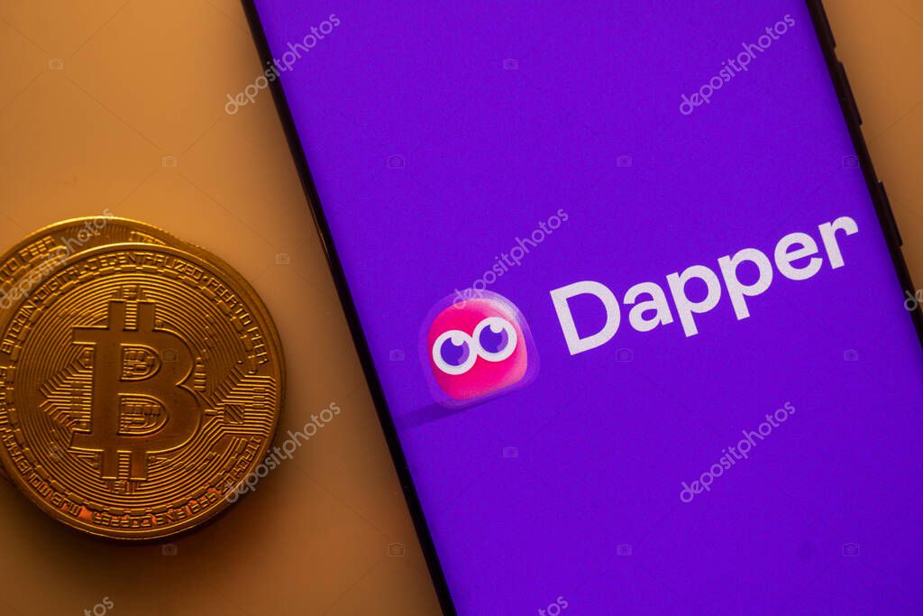 Dhaka, Bangladesh 22 September 2025:Dapper logo displayed on a smartphone next to a Bitcoin coin