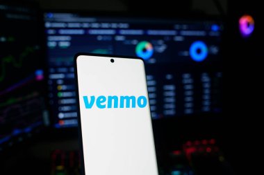 Dhaka, Bangladesh 22 September 2025:A Bitcoin and Venmo logo on a blue screen representing cryptocurrency