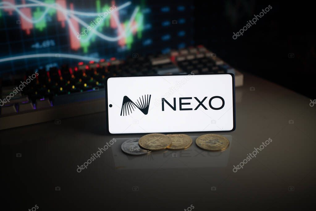 Dhaka, Bangladesh 18 September 2025:NEXO logo displayed with coins and market graph amid neon lights