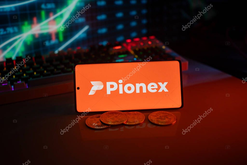 Dhaka, Bangladesh 18 September 2025:Pionex logo on smartphone with coins, orange neon lights, and trading charts in background