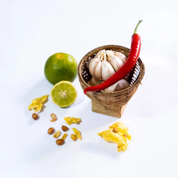ingredients of indonesian\'s foods with white background. chili, lime, and garlic