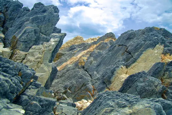 Stock image Uljin County, South Korea - July 27th, 2024: A detailed view of the rugged and weathered rock formations at Gatbawi Rock, showcasing the natural textures and geological beauty along the East Sea coast.