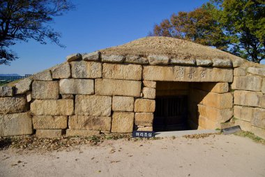 Gyeongju City, South Korea - November 11th, 2023: Seokbinggo, a Joseon-era stone ice storage facility, located inside the northern walls of Banwolseong Fortress. Its structure showcases advanced drainage and ventilation design. clipart