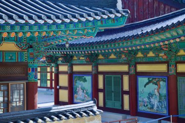 Ulsan, South Korea - October 22nd, 2023: Vibrant architectural details of Seoknamsa Temple, showcasing traditional Korean craftsmanship with intricate patterns, colorful murals, and curved rooflines. clipart