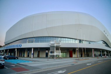 Gangneung, South Korea - November 3rd, 2024: Wide-angle view of Gangneung Arena, a key venue from the PyeongChang 2018 Winter Olympics, highlighting its modern architectural design in Gangneung, South Korea. clipart