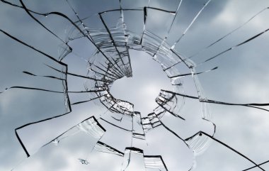 Texture of broken window. Hole in the window glass.