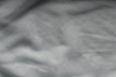 Katlı ve gölgeli kumaş dokusu arkaplanının yakınlaştırılması