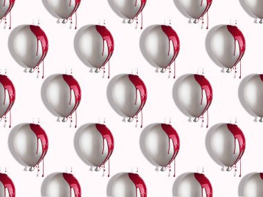 Kırmızı boya damlayan gri balonlar. Asgari yaratıcı desen.