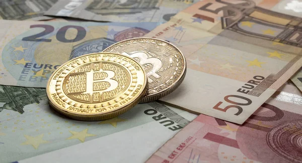 stock image golden bitcoin coin on euro close up