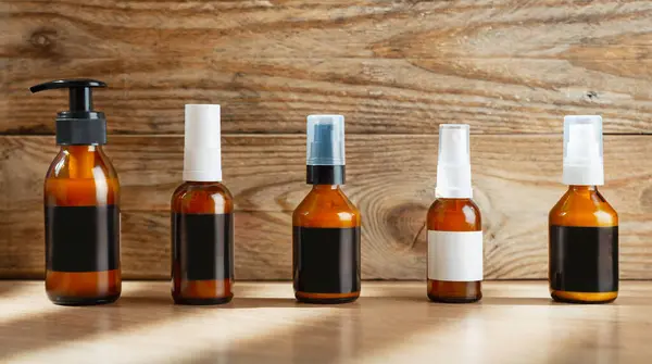 Dark Cosmetic Amber Glass Bottles Set Dark Blank Labels Cosmetics — Stock Photo, Image