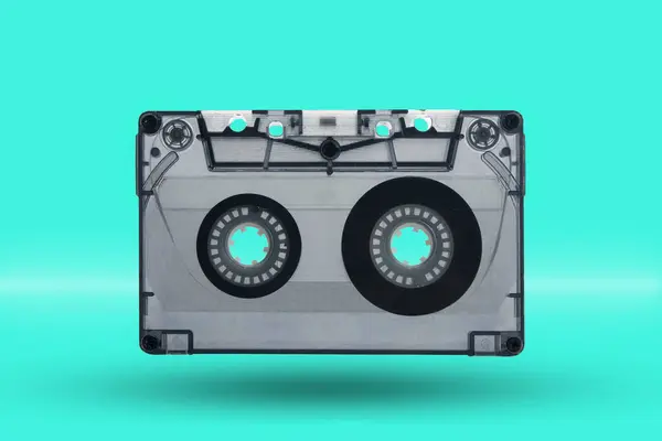 Magnetic tape cassettes on a turquoise background. Old fashioned style.