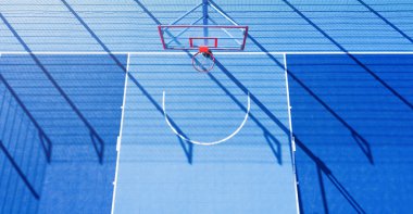 Minimalistic abstract background of blue basketball court at daylight. Aerial view. clipart