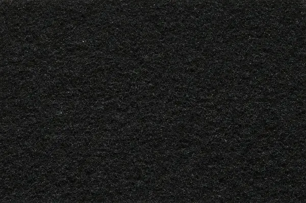 Close-up of the black color of the sponge texture