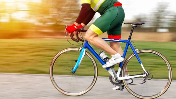 Cyclist on a road bike. Active sport. Professional athlete on a sports bike. Motion blur effect.