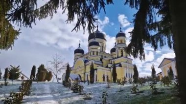 Hancu Monastery outdoors winter view. Traditional Christian Orthodox church located in the middle of the snowy woods in Republic of Moldova. Eastern Europe basilica traditional architecture style
