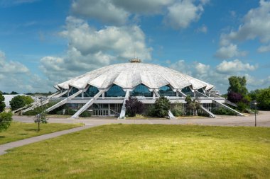 Modernism architecture. Arena, an indoor sporting arena in the Grunwald district of the city of Pozna in western Poland. clipart