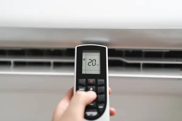 Remote. Setting the temperature in the air conditioning. Cooling down on a hot day. Summer heat. Maintenance of air conditioning equipment.
