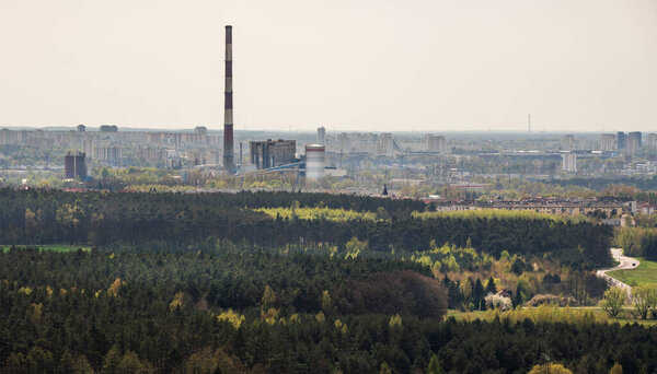 Poznan, Greater Poland, Poland, april 07, 2024. View of the city's thermal power plant. View of city among greenery
