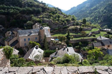 Picturesque village in the Gorges du Tarn in France with a typical bridge