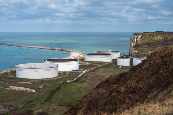 Oil storage tanks on the Cte d'Albatre in Normandy, France, on a harbour by the sea